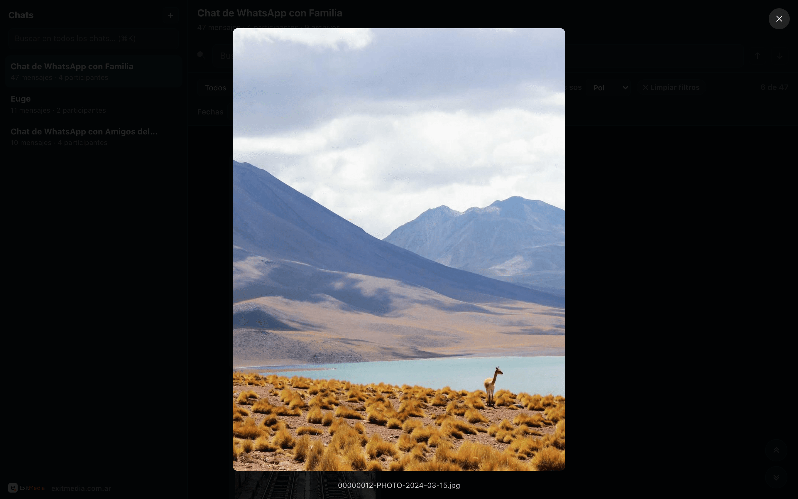 A photo of a mountain lake opened fullscreen in WhatsArchive’s viewer.